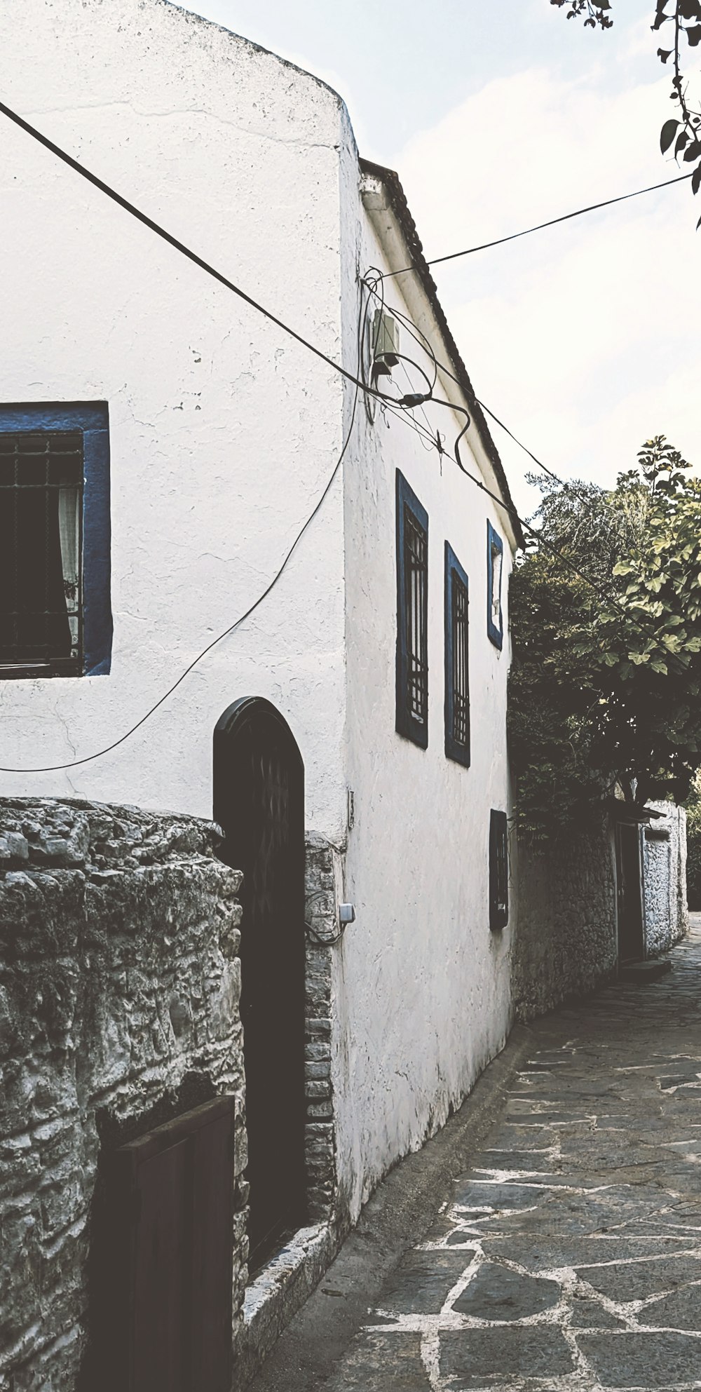 a white building with a black door