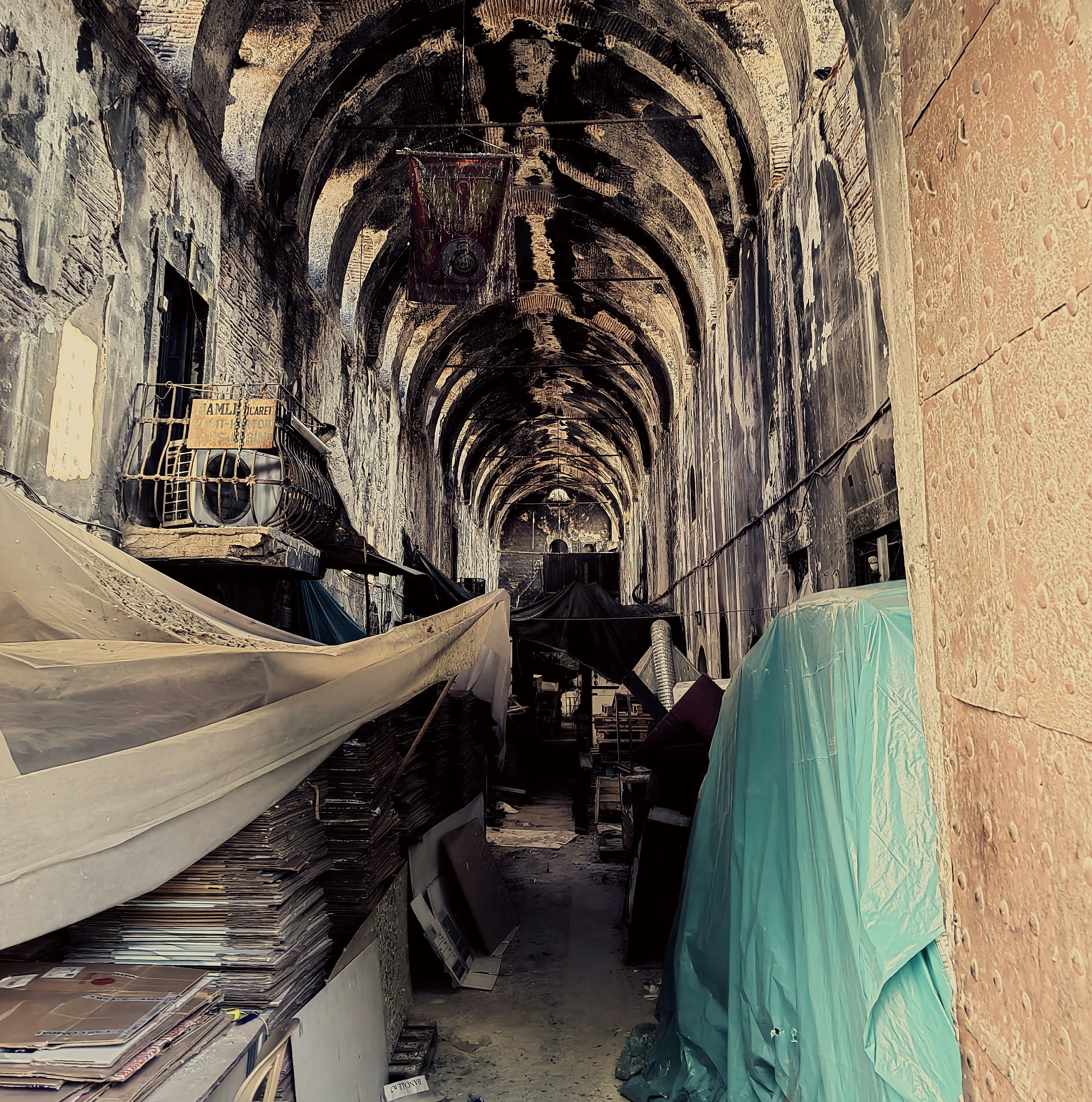 a room with a few beds and a few mattresses