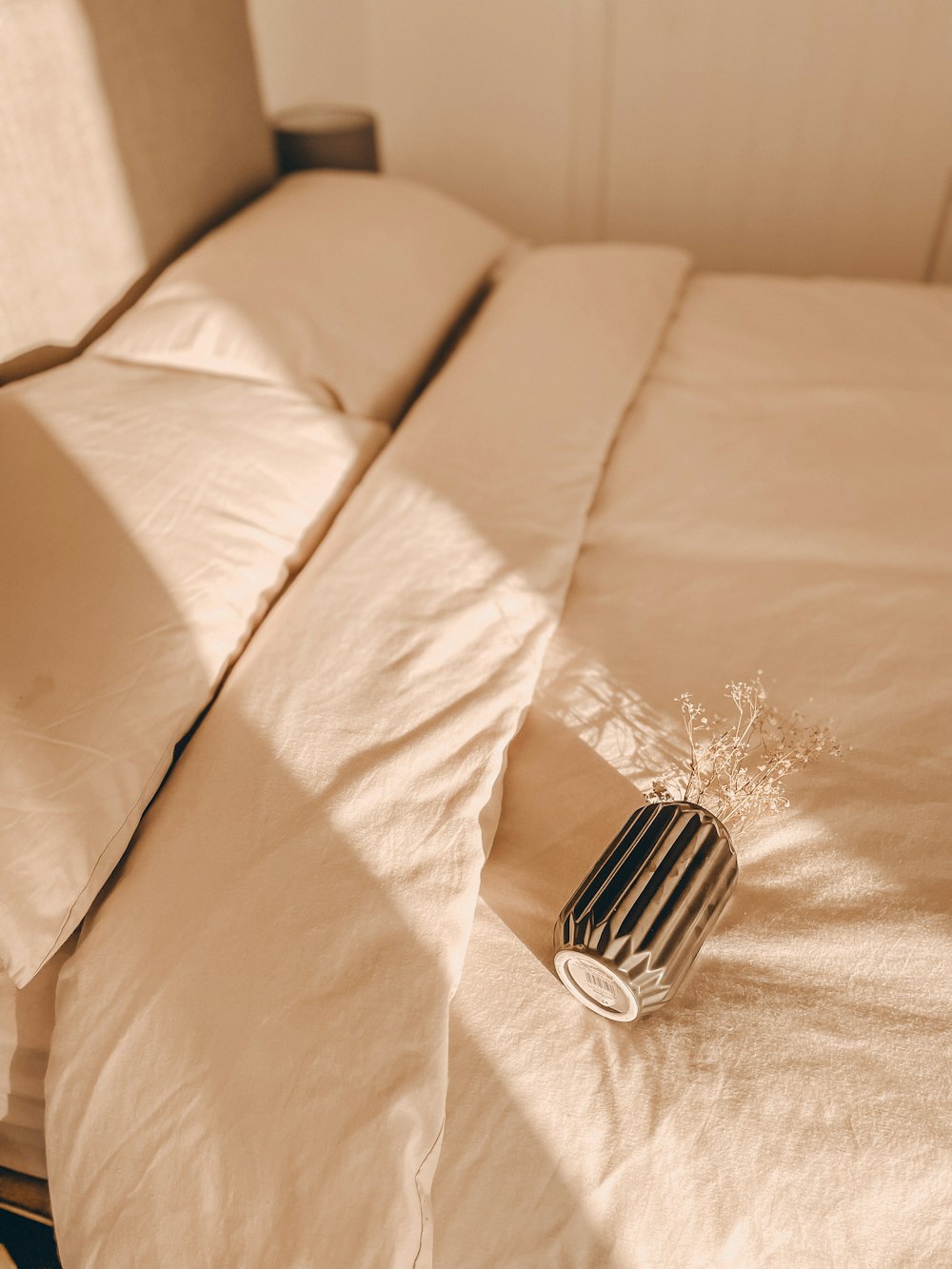 a white couch with a white flower on it