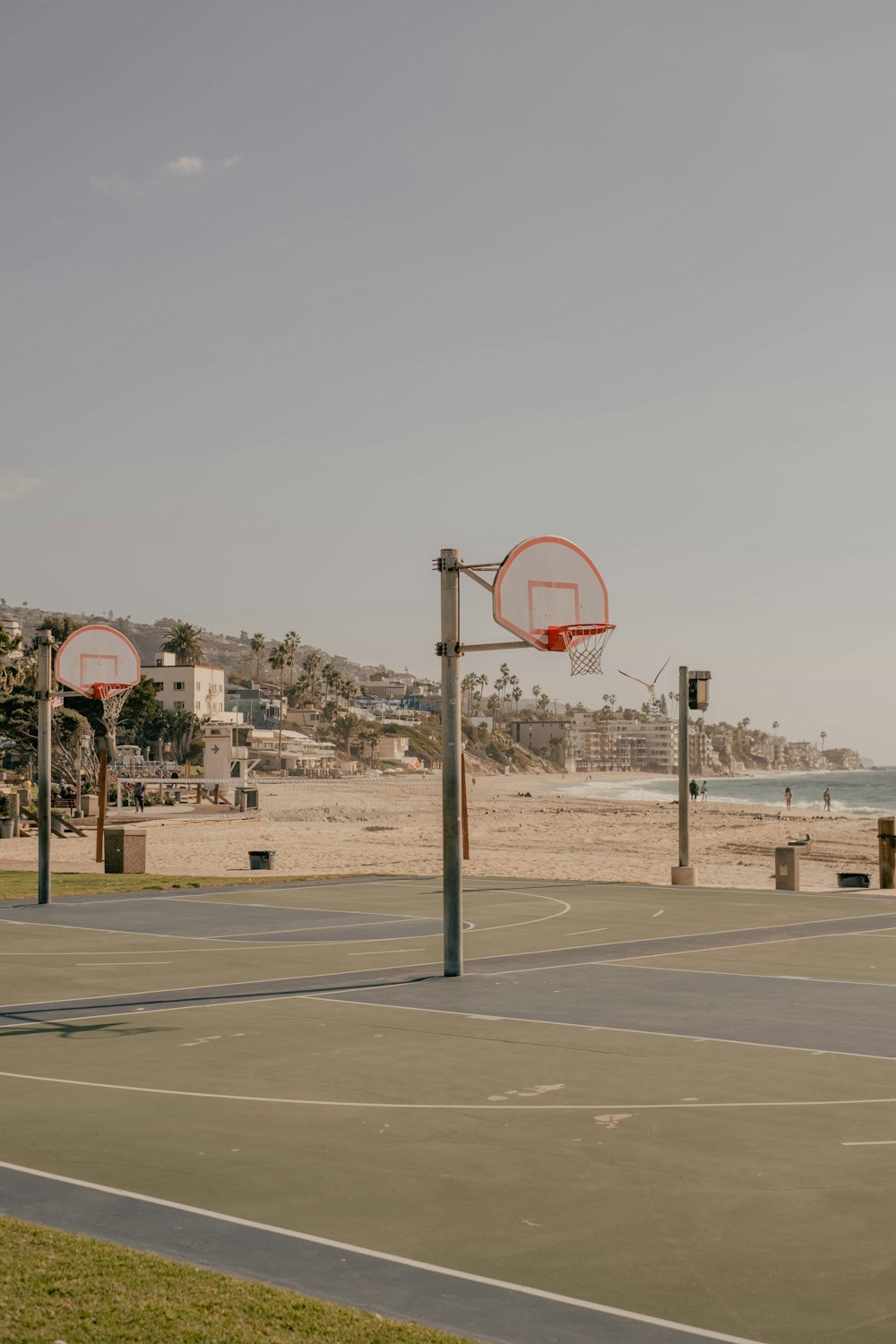 a basketball hoop on the side of a road