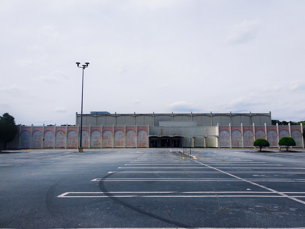 a large building with a parking lot