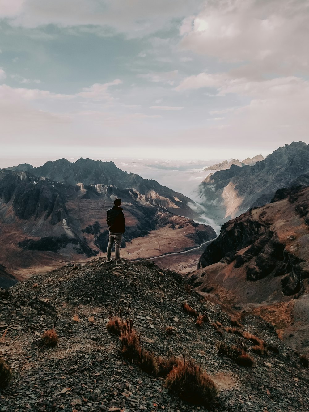 a man walking on a rocky path