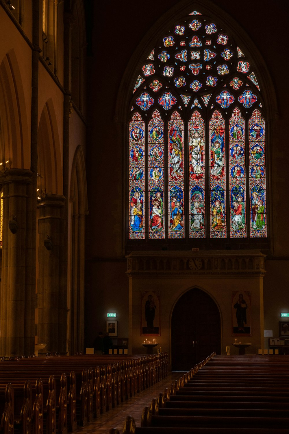 a large stained glass window in a church