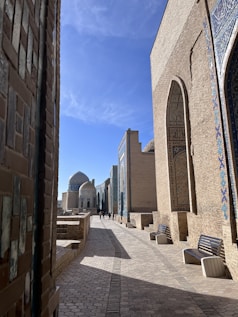a street with benches and buildings