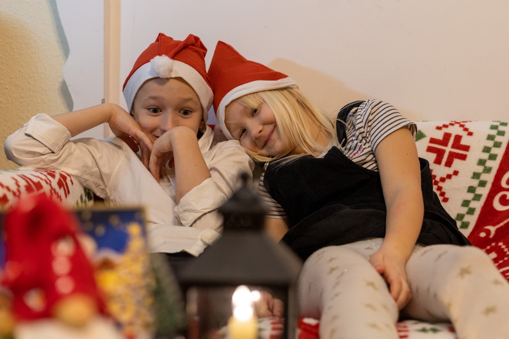 a couple of women wearing santa hats