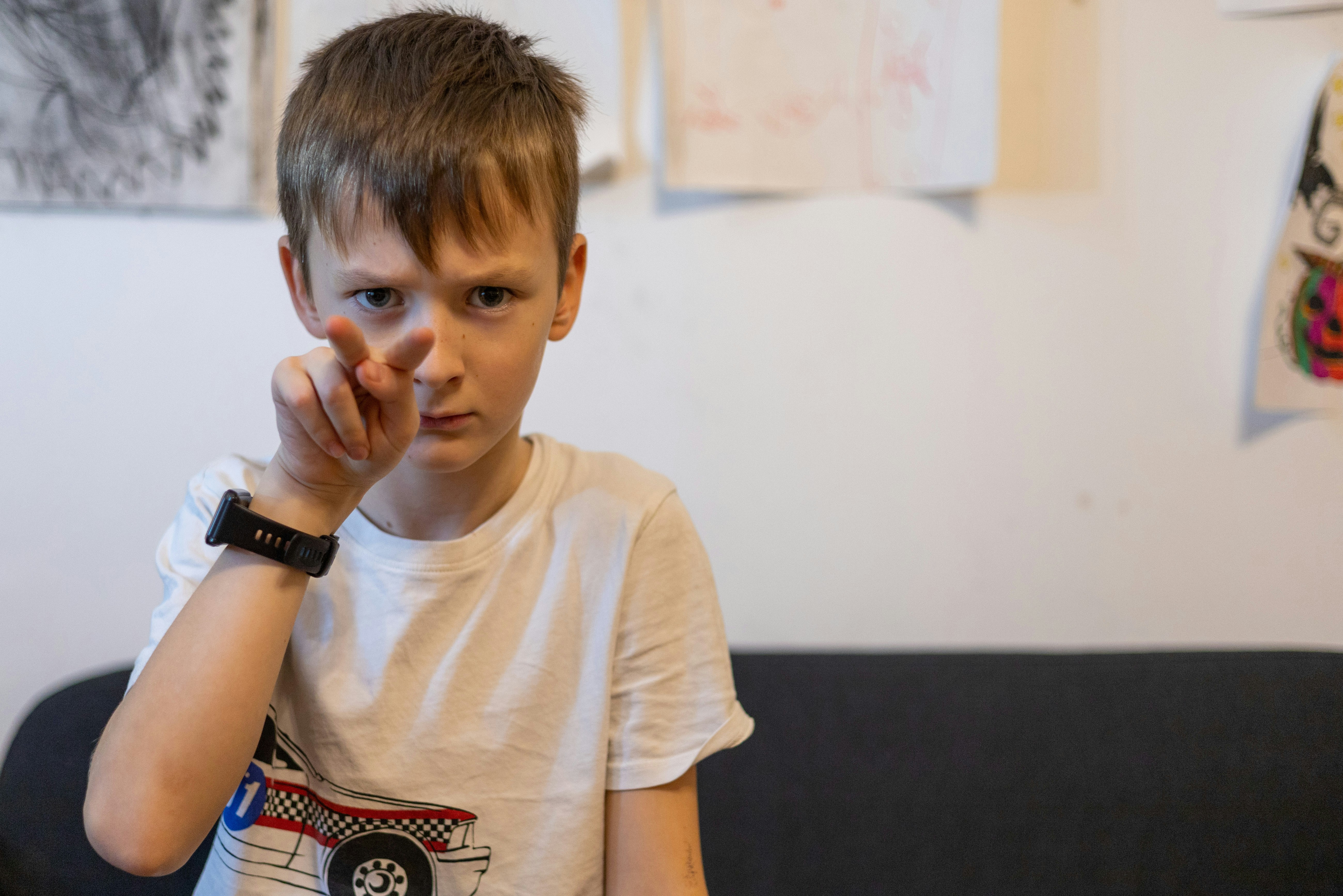 a boy sitting on a couch