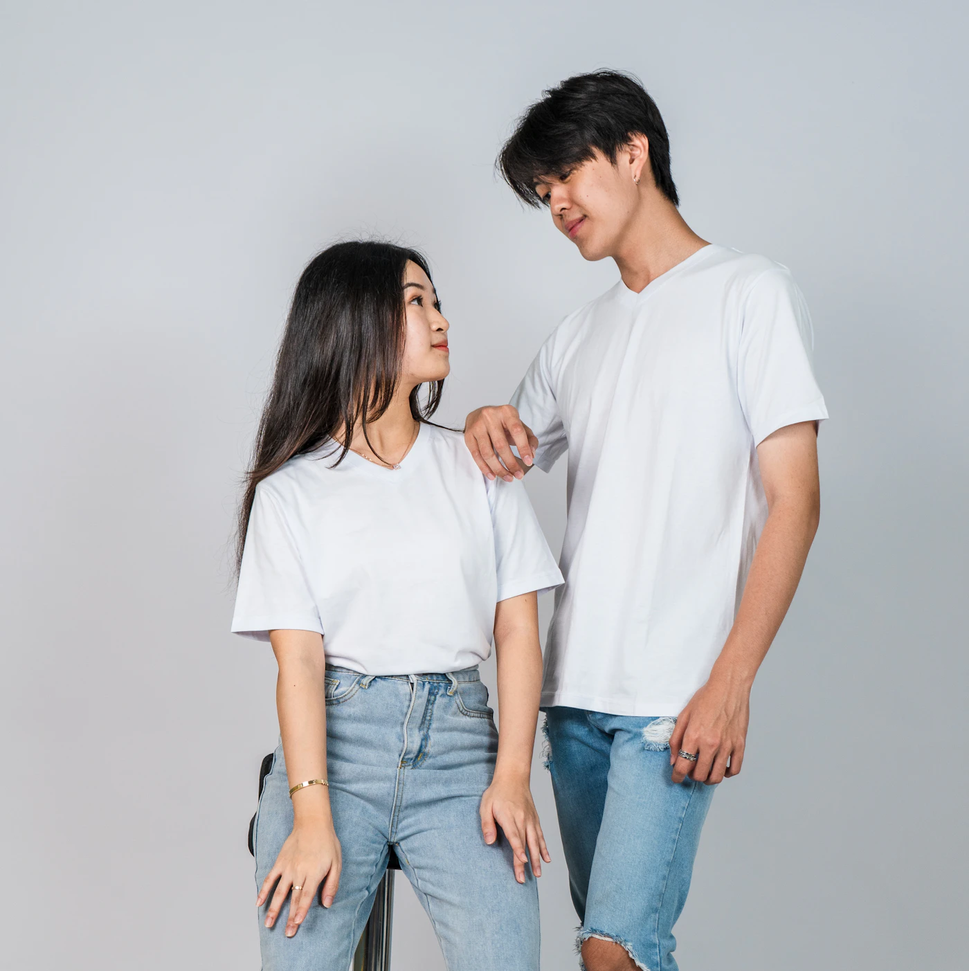 Couple wearing matching graphic t-shirts on a trip