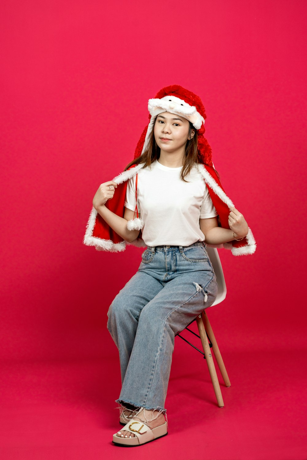 a woman sitting on a stool