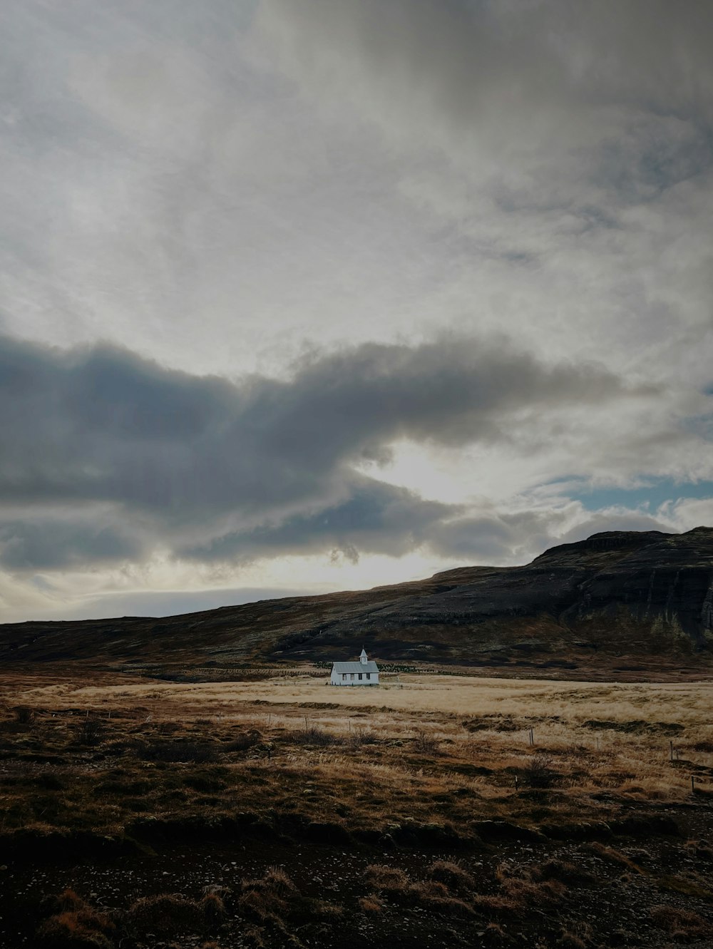 a white building in a field