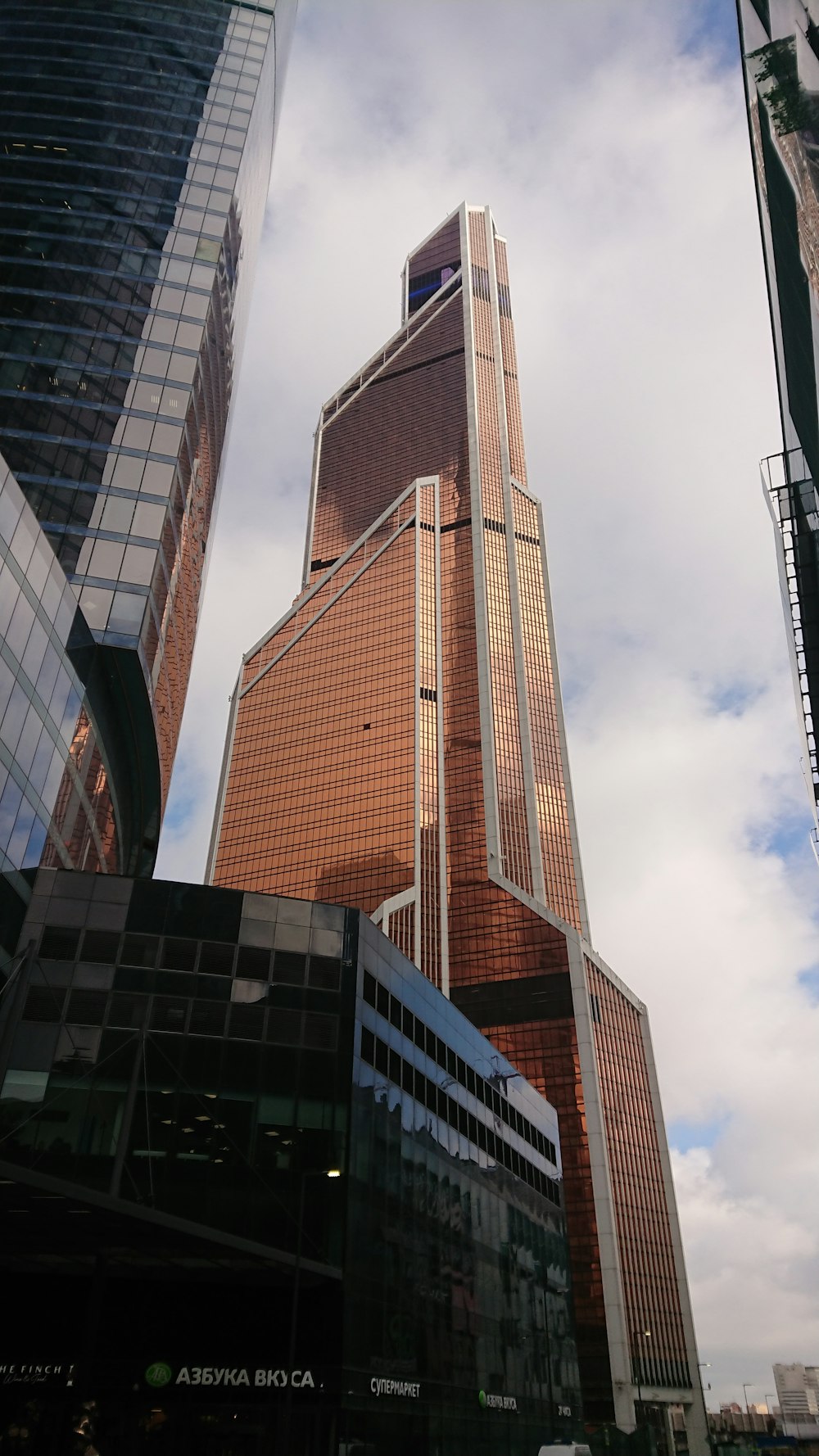 a tall building with a glass front