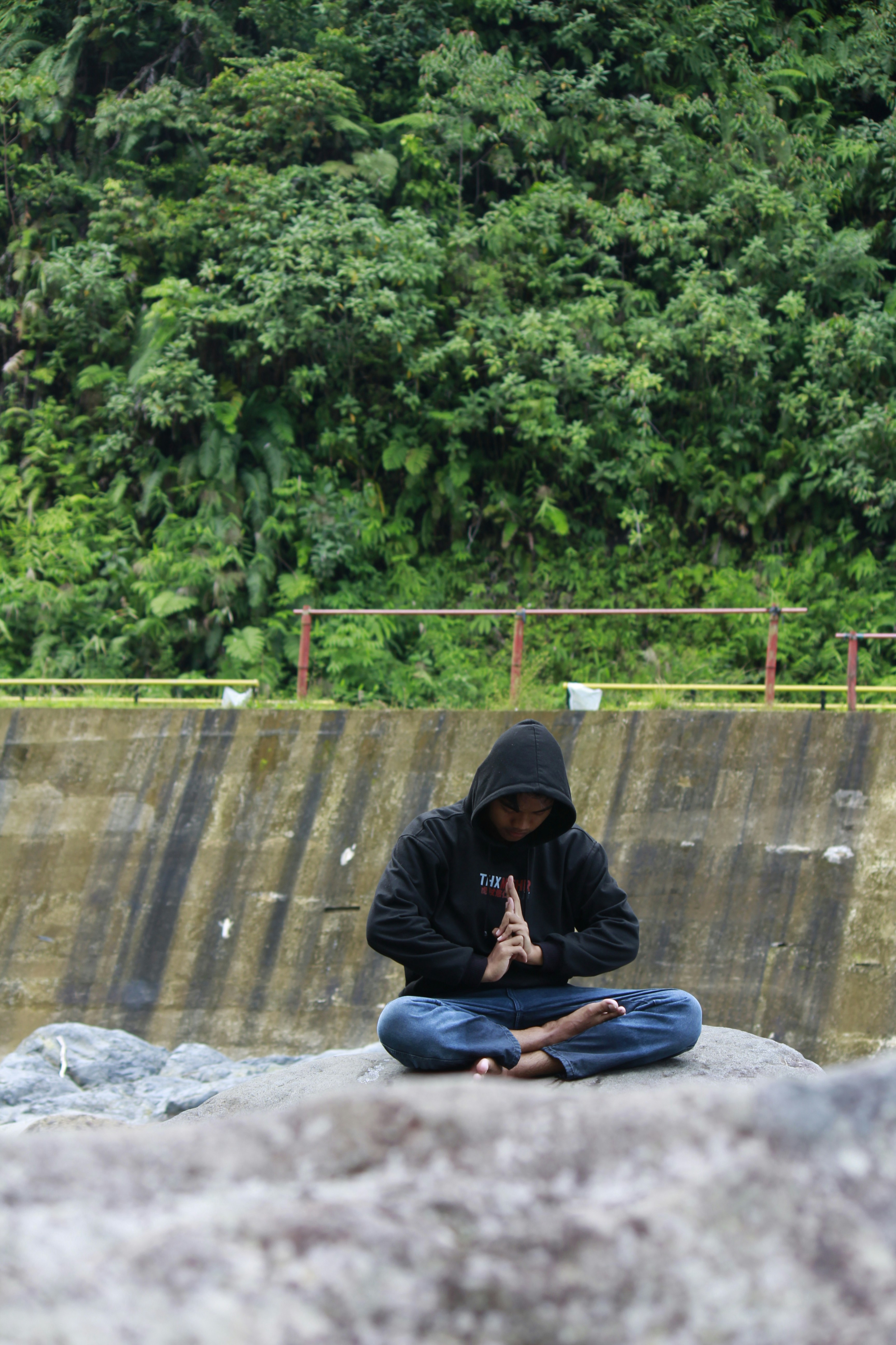 Person meditating with crystals during Reiki charging