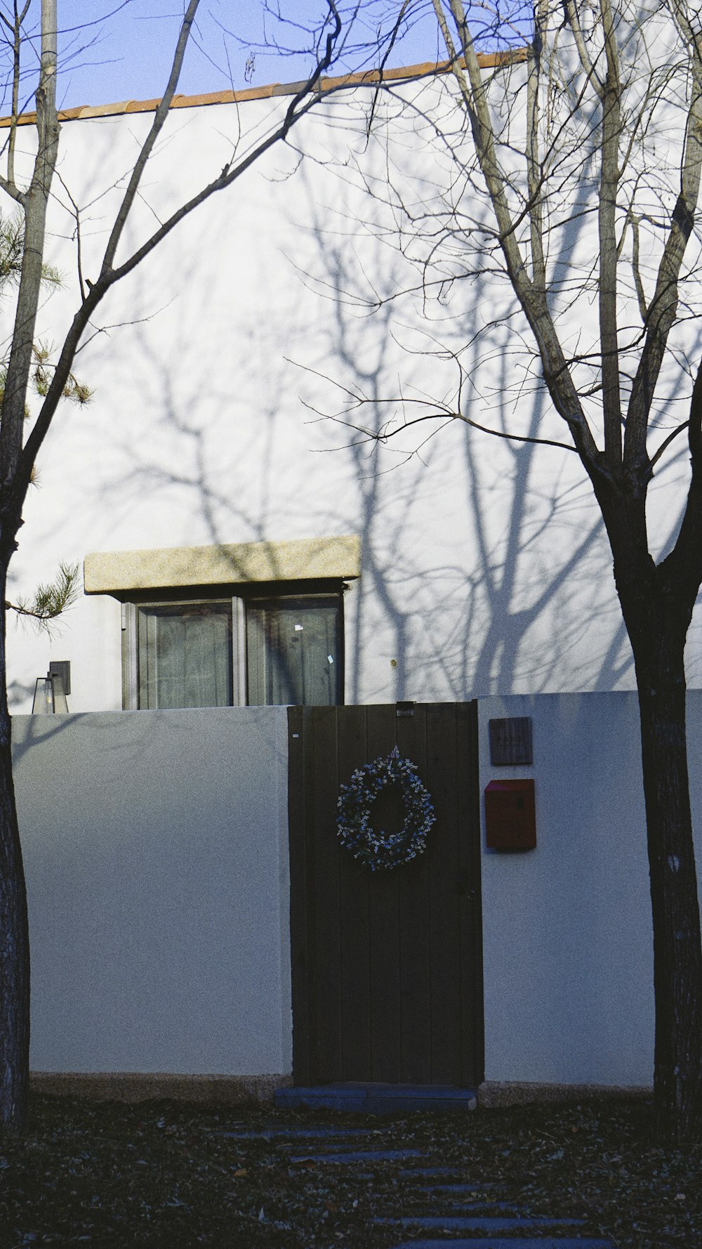 a small building with a tree in the front