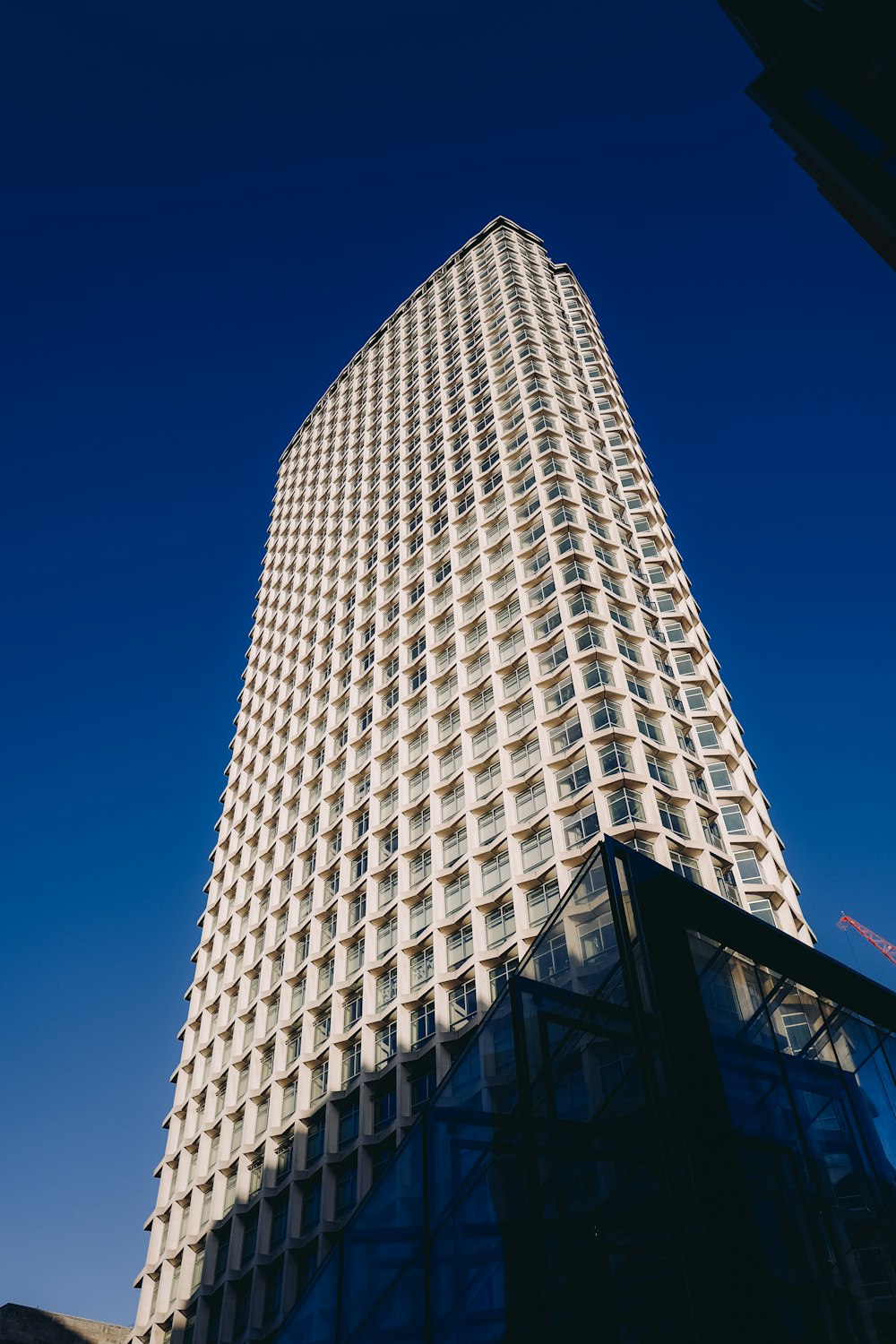 a tall building with a blue sky