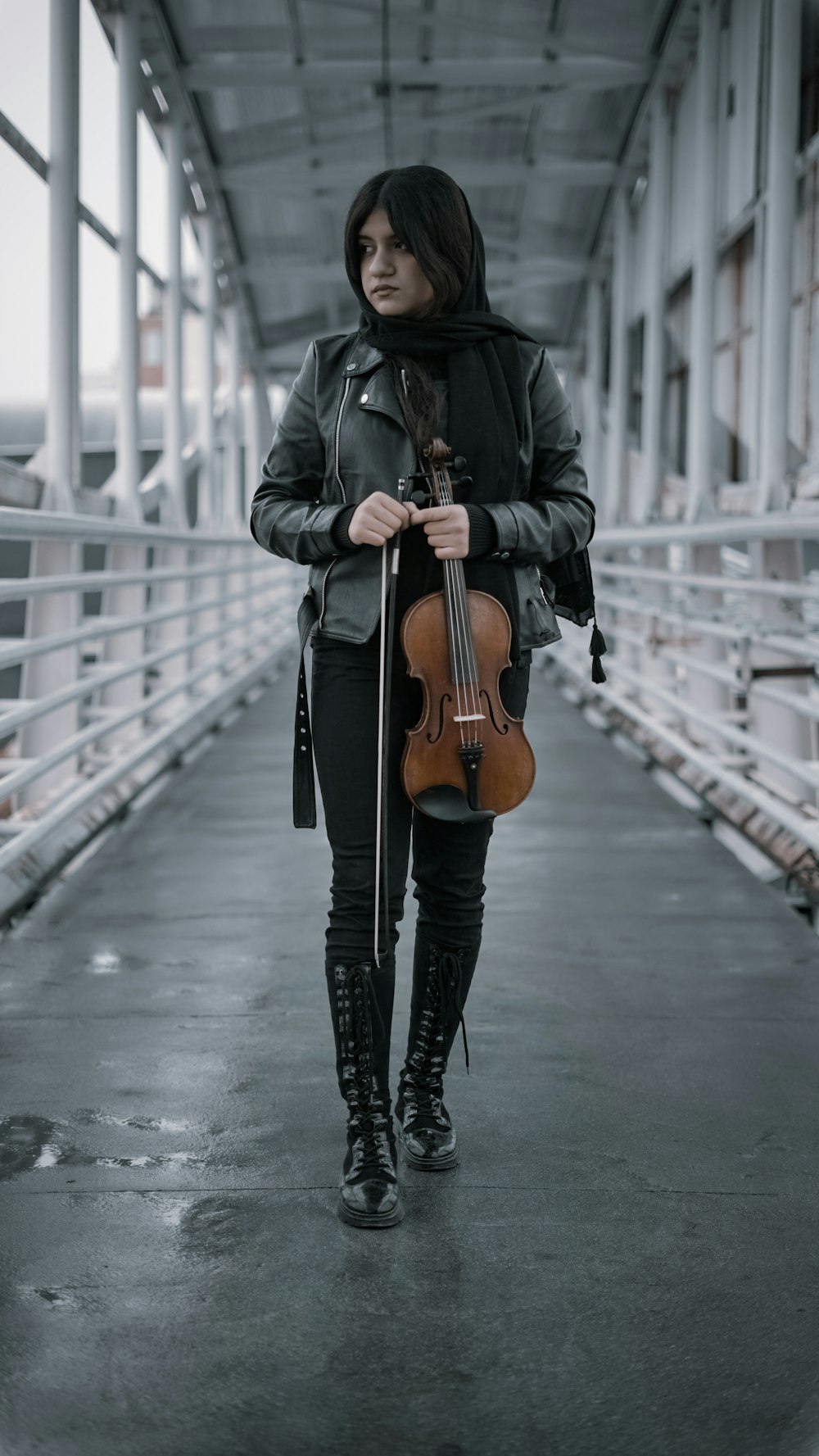 a woman holding a violin
