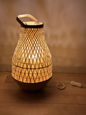 Modern 3D printed lamp with intricate lattice design glowing warmly.