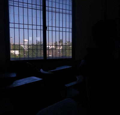 a person sitting in a dark room