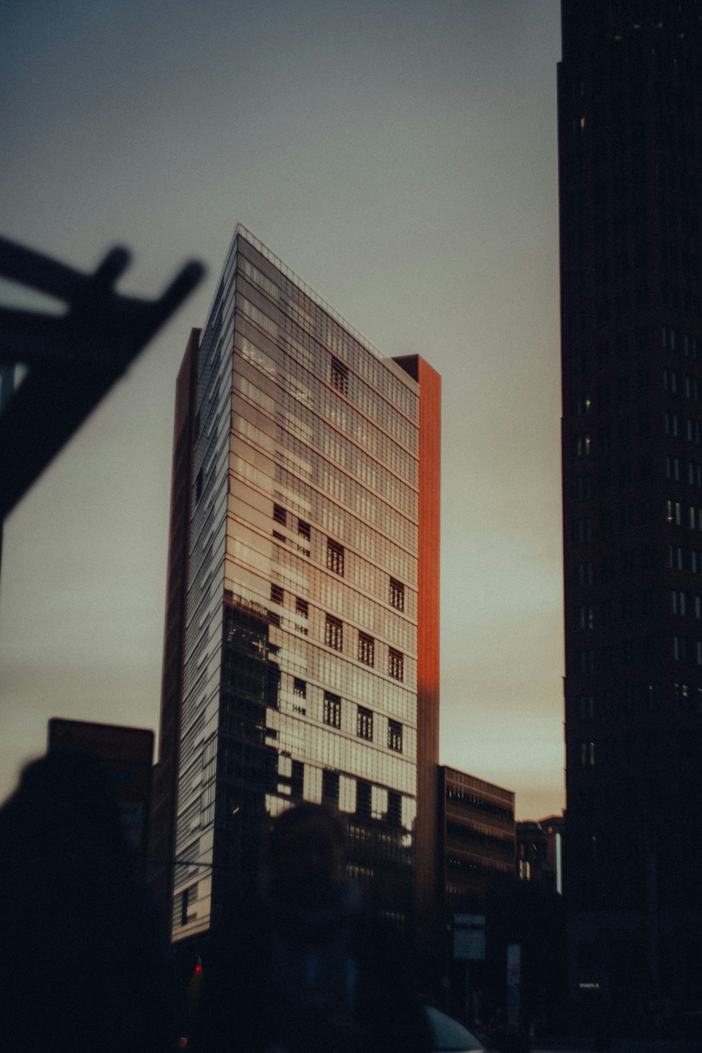 a tall building with a dark sky