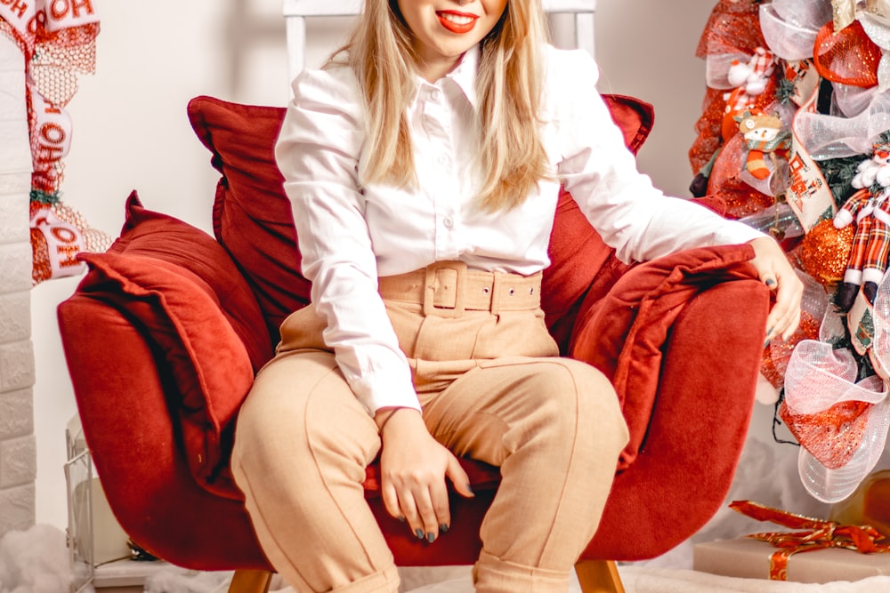 a person sitting on a red couch