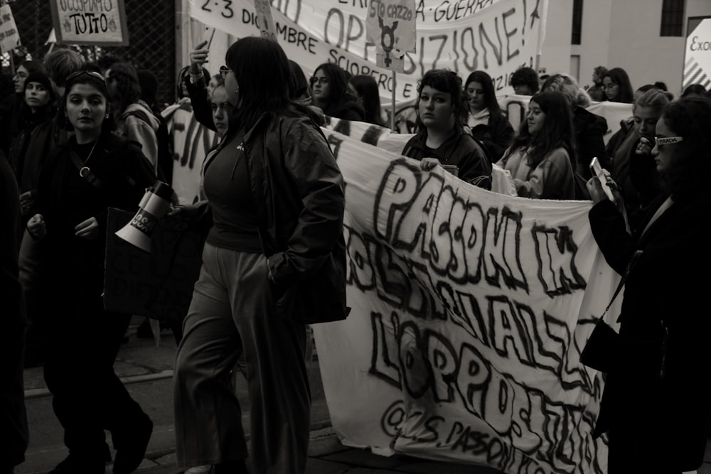 a group of people holding signs