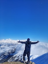 a person standing on a mountain