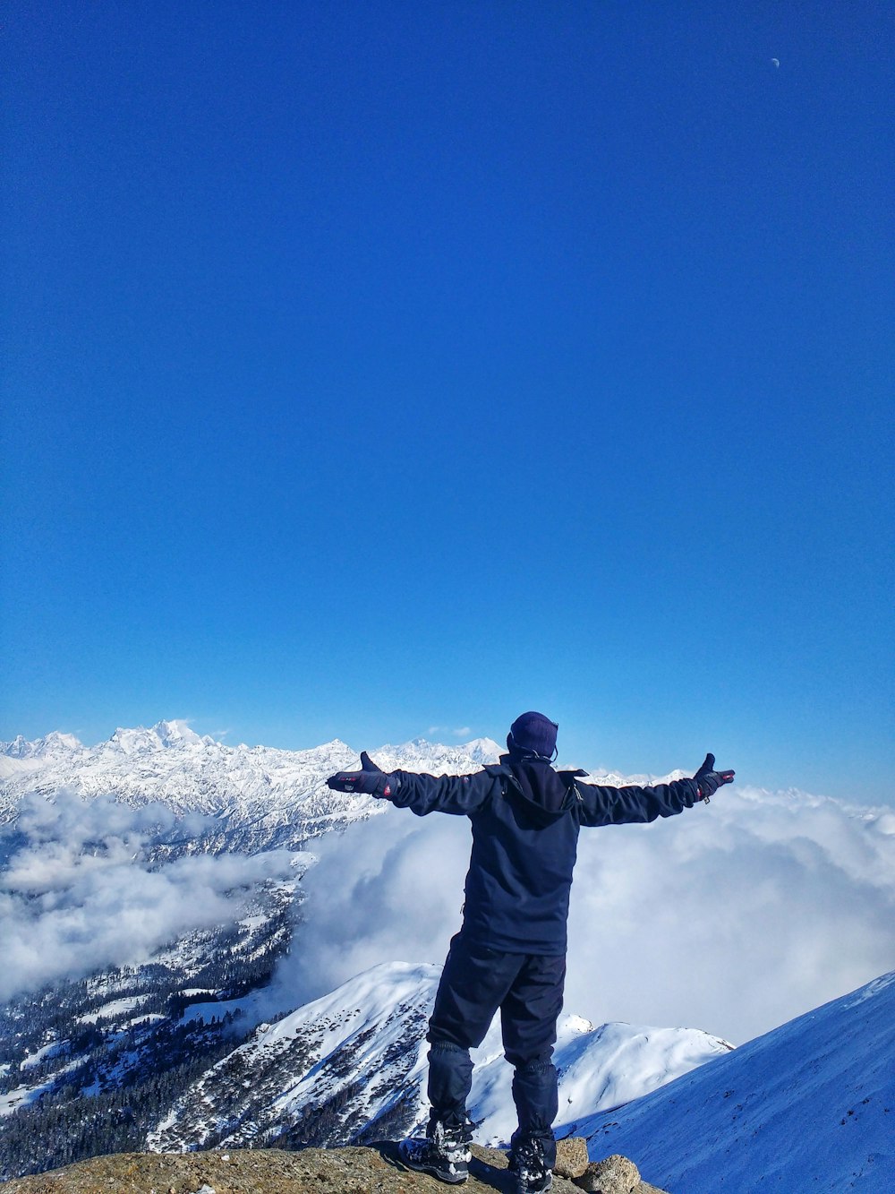 a person standing on a mountain