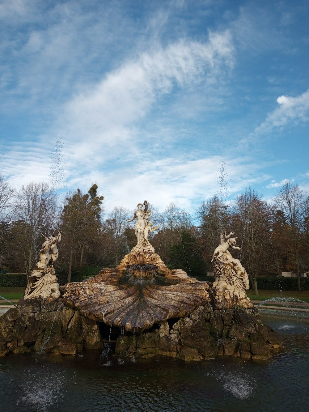 a group of statues on a rock