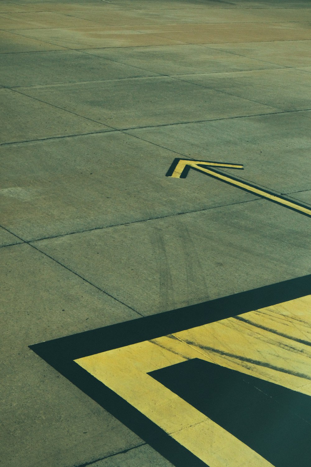 a yellow line on a paved area