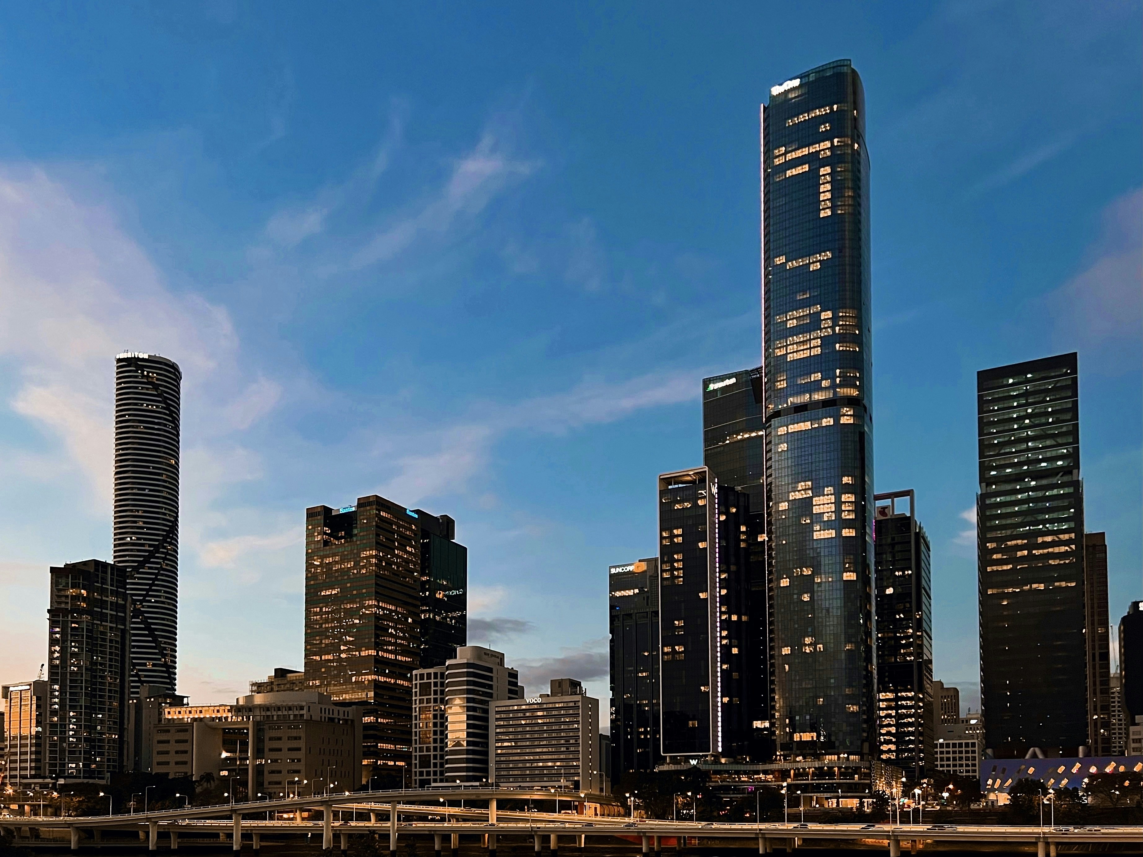 a city skyline with tall buildings