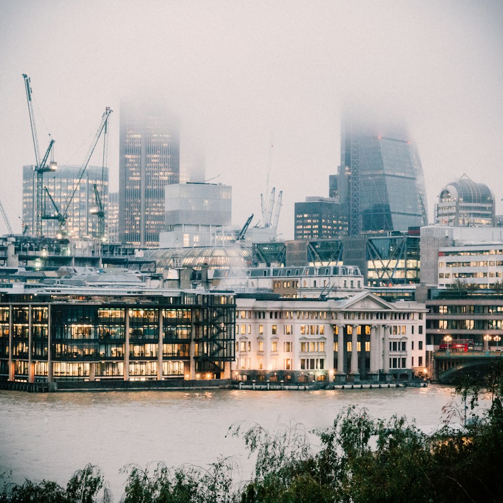 a city with cranes and buildings