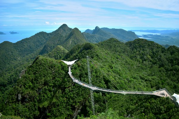A bird on a power line with Langkawi in the background