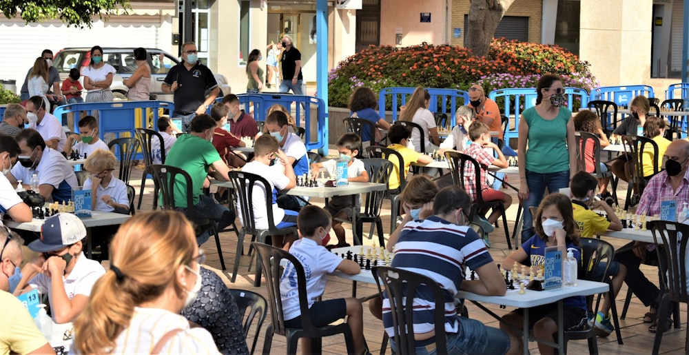 a group of people sitting at tables