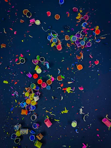 Close-up of vibrant, melted crayon pieces blending into a swirling marbled pattern.