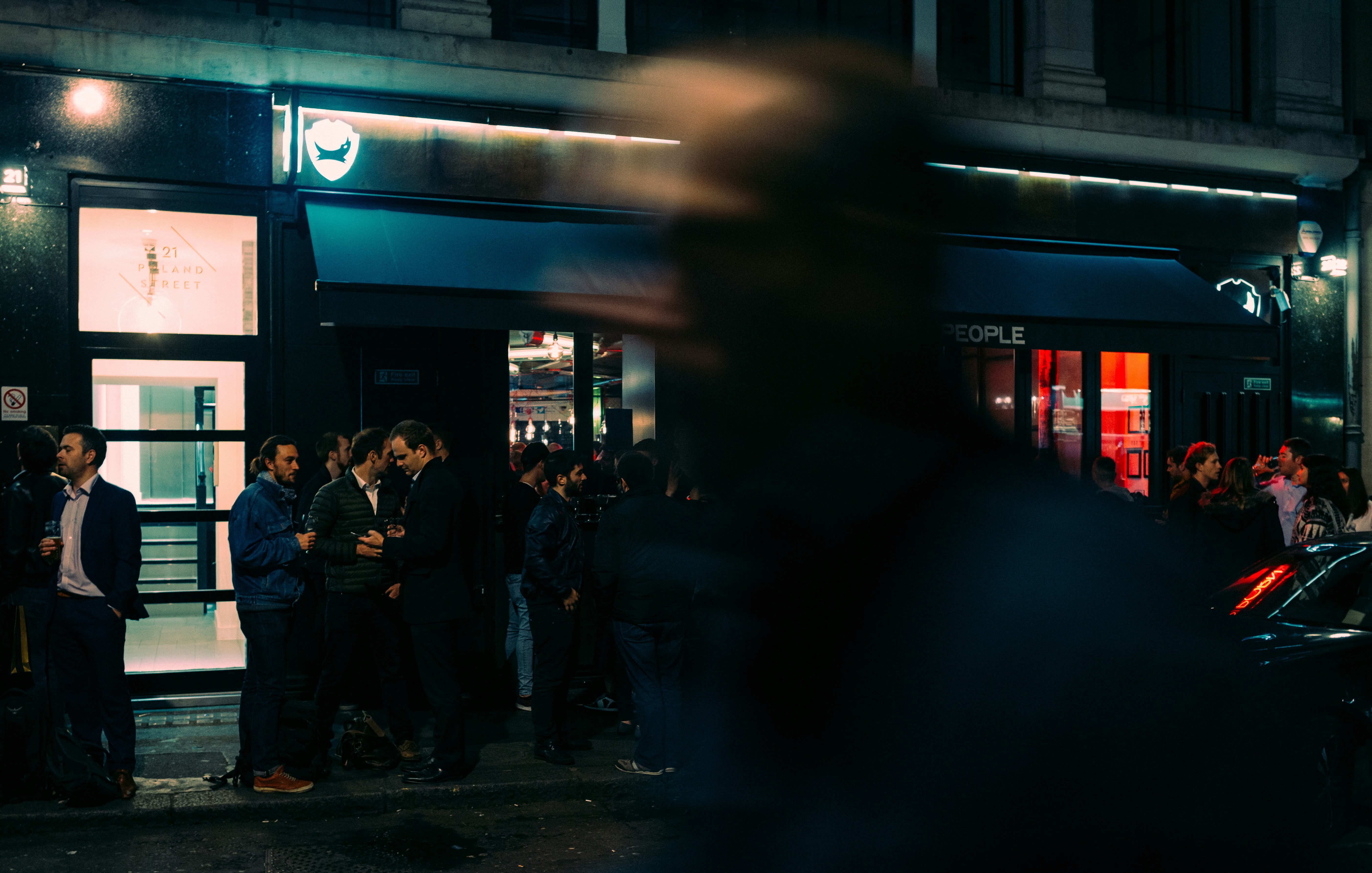 a group of people standing outside a building
