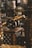 A small, decorative brass cannon is placed atop a carved wooden surface with intricate geometric patterns. The background is blurred, filled with various ornamental and metallic objects, contributing to a sense of opulence and historical ambiance.