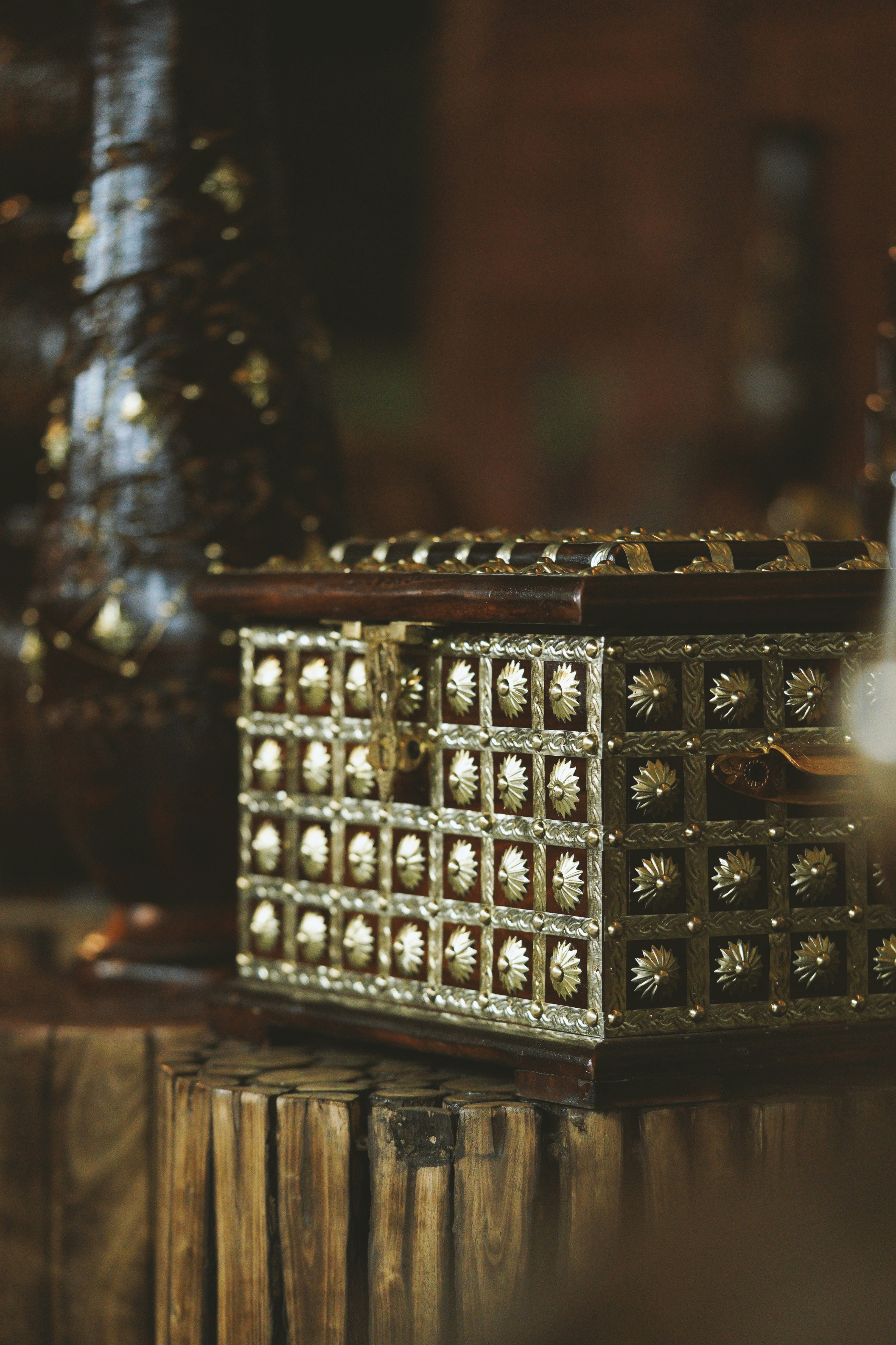 a wooden box with a metal object on top