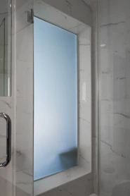 a shower with a glass door