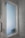 A frosted glass window set within a marble-tiled wall, featuring a chrome handle on the left. The surrounding walls have a polished marble finish with gray veining, adding to the modern aesthetic of the space.