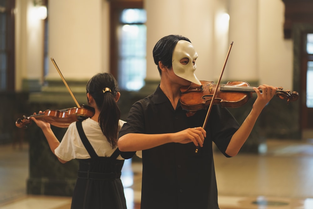 a woman playing a violin