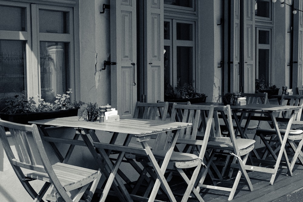 a group of tables and chairs outside a building