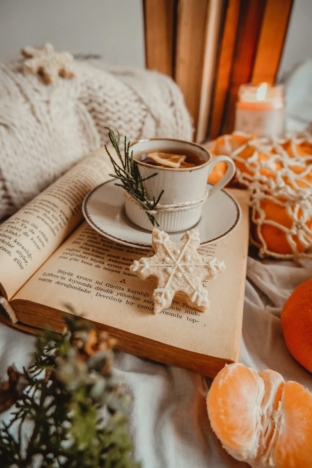 a cup of coffee and a book on a table