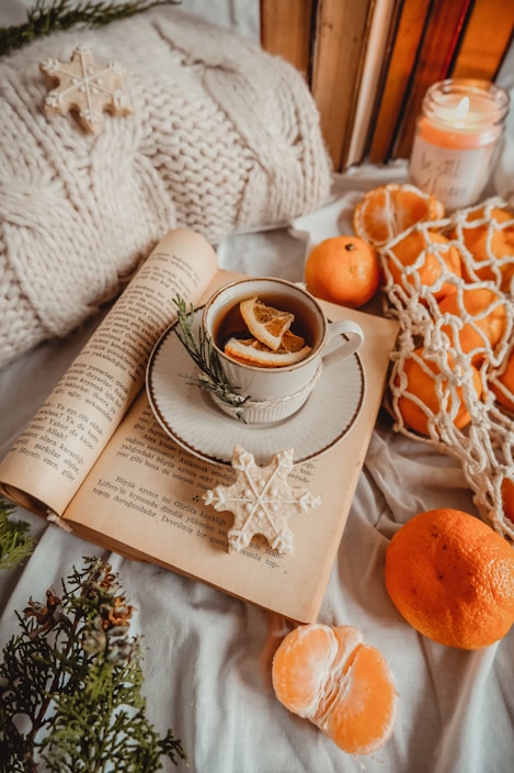 A calming arrangement of recovery journals, motivational books, and herbal teas on a wooden table.