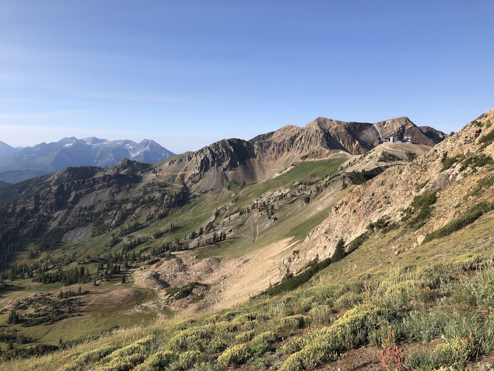 a valley with mountains in the background