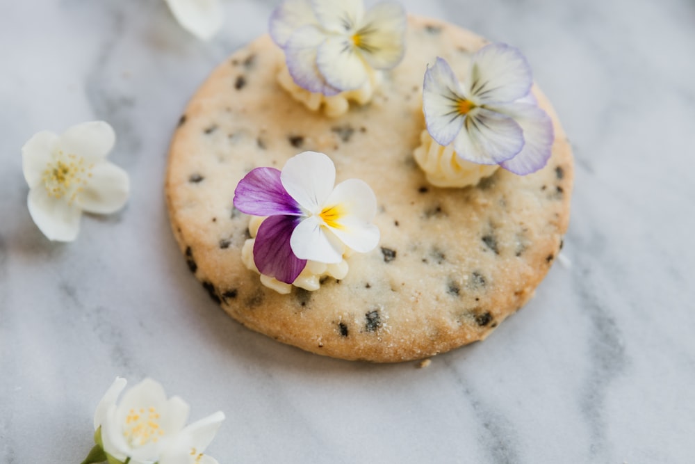 a cookie with flowers on top