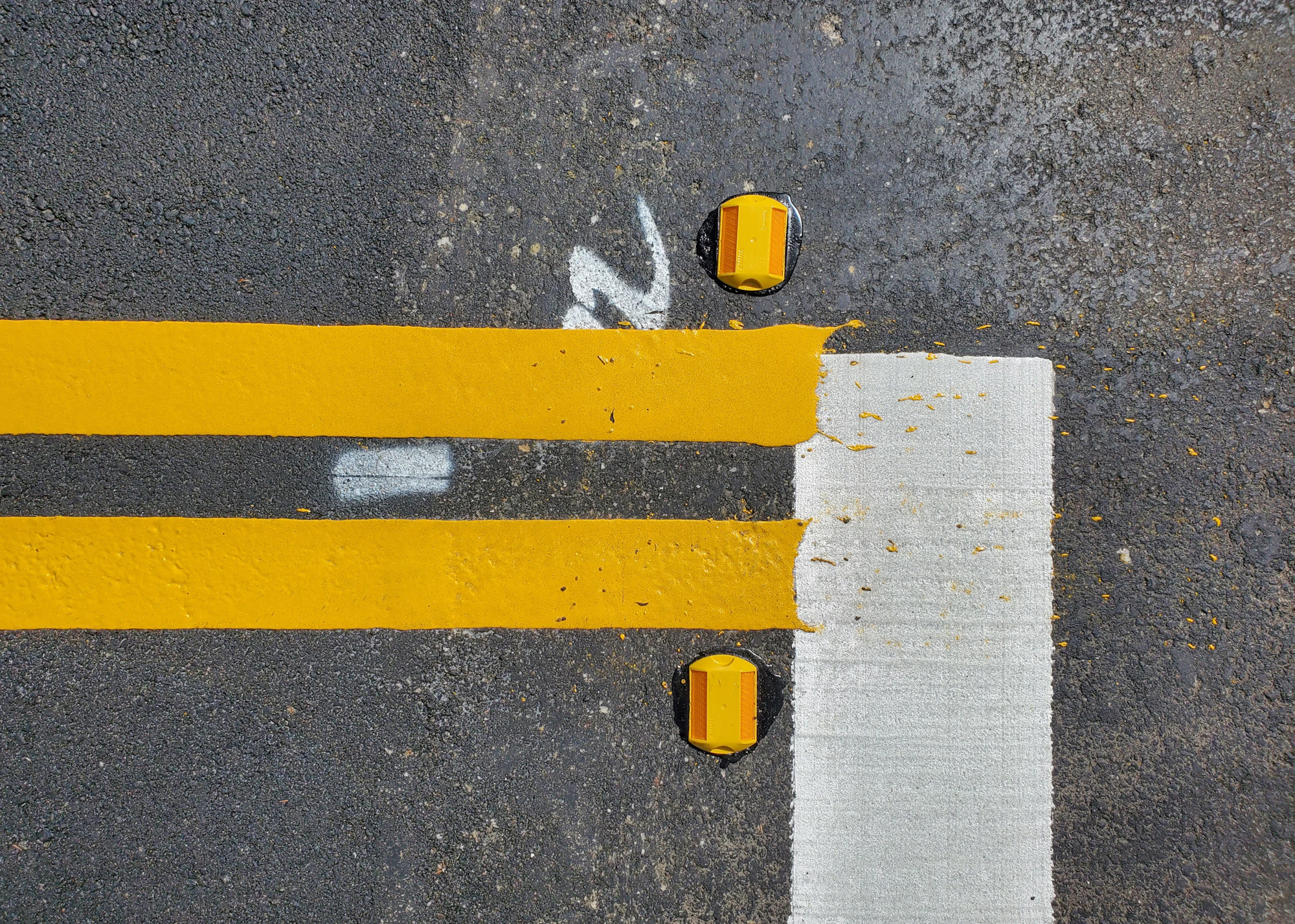 Close-up of freshly applied thermoplastic road markings — REPLACE