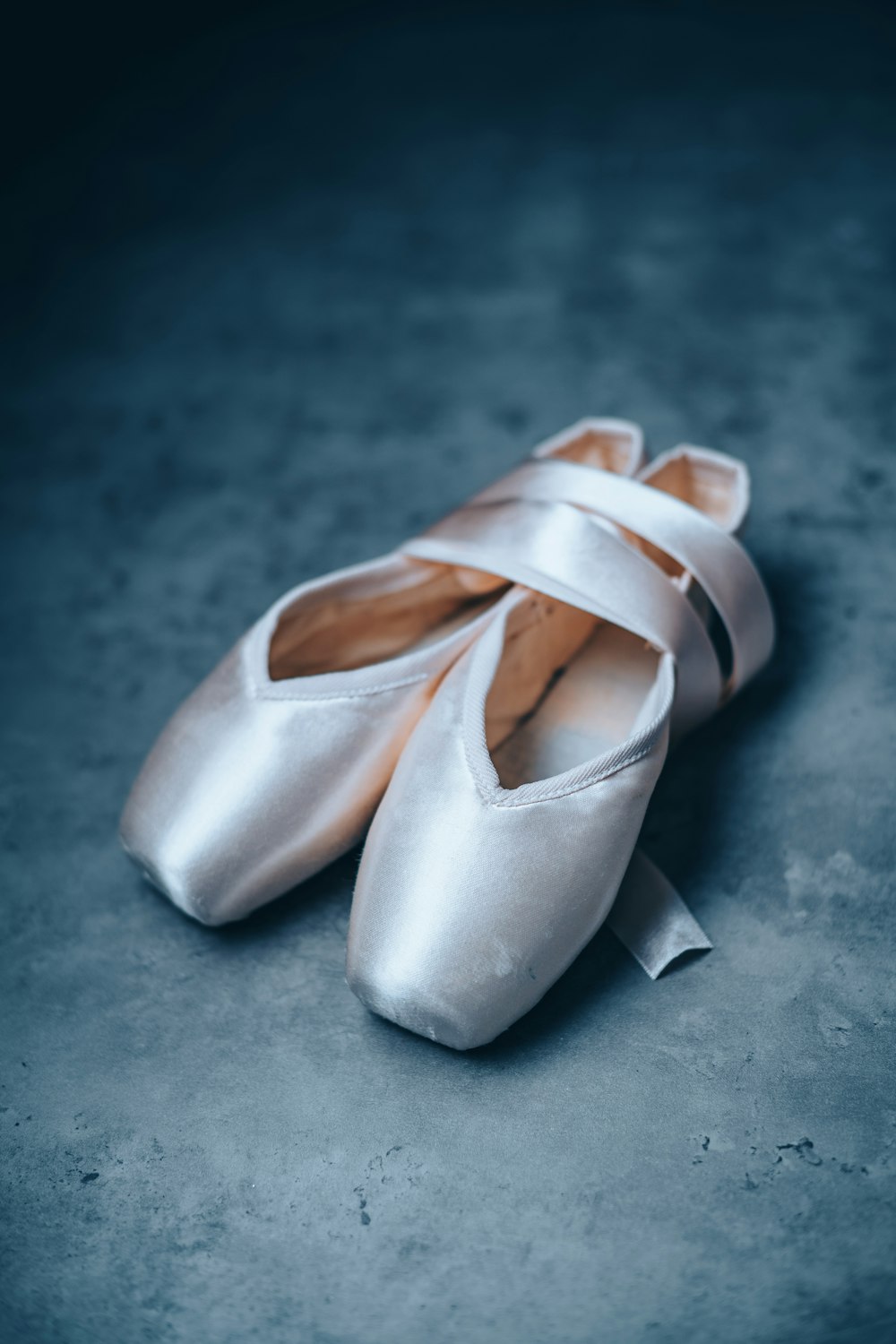 a white slipper with a white lace