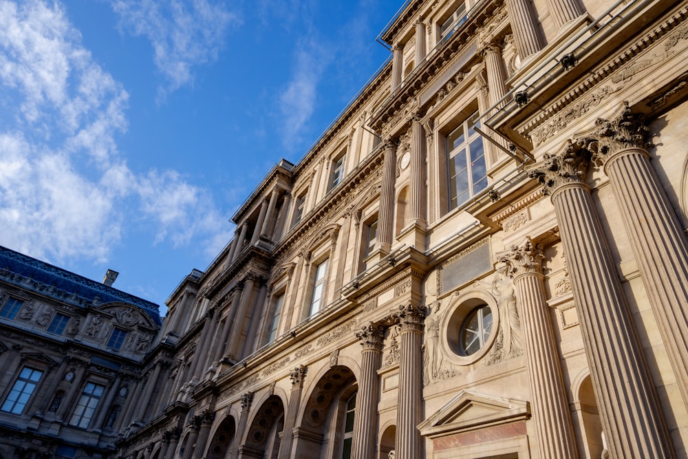 a building with columns and a blue sky