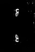 Bright, clear headlights shining on a dark road after renovation.