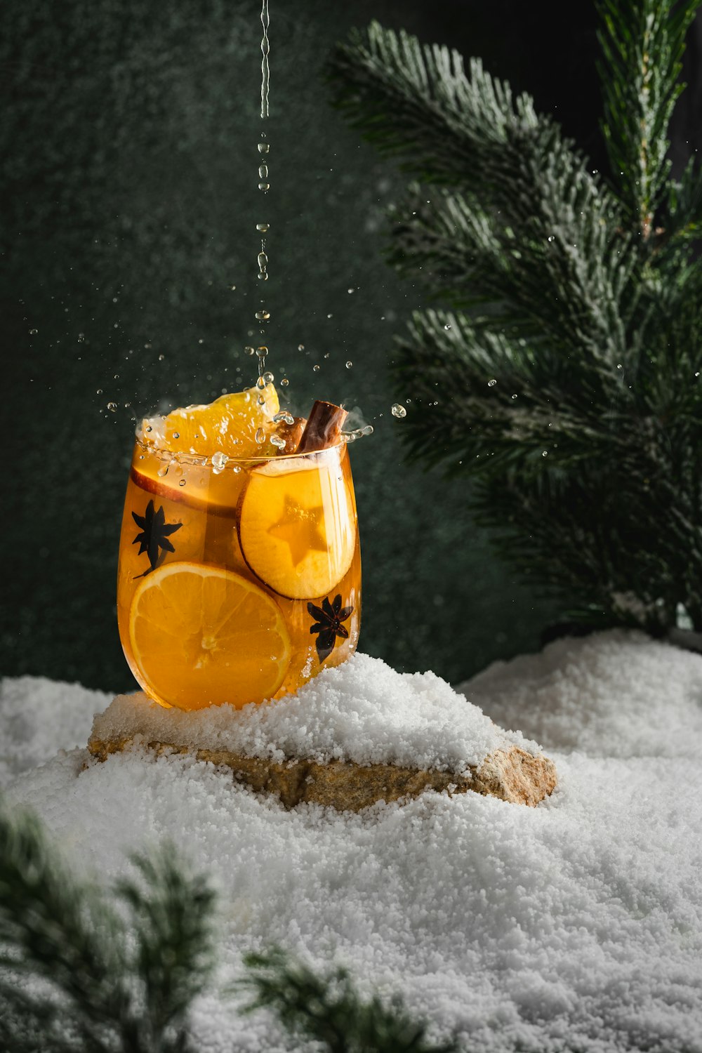 a carved pumpkin in the snow