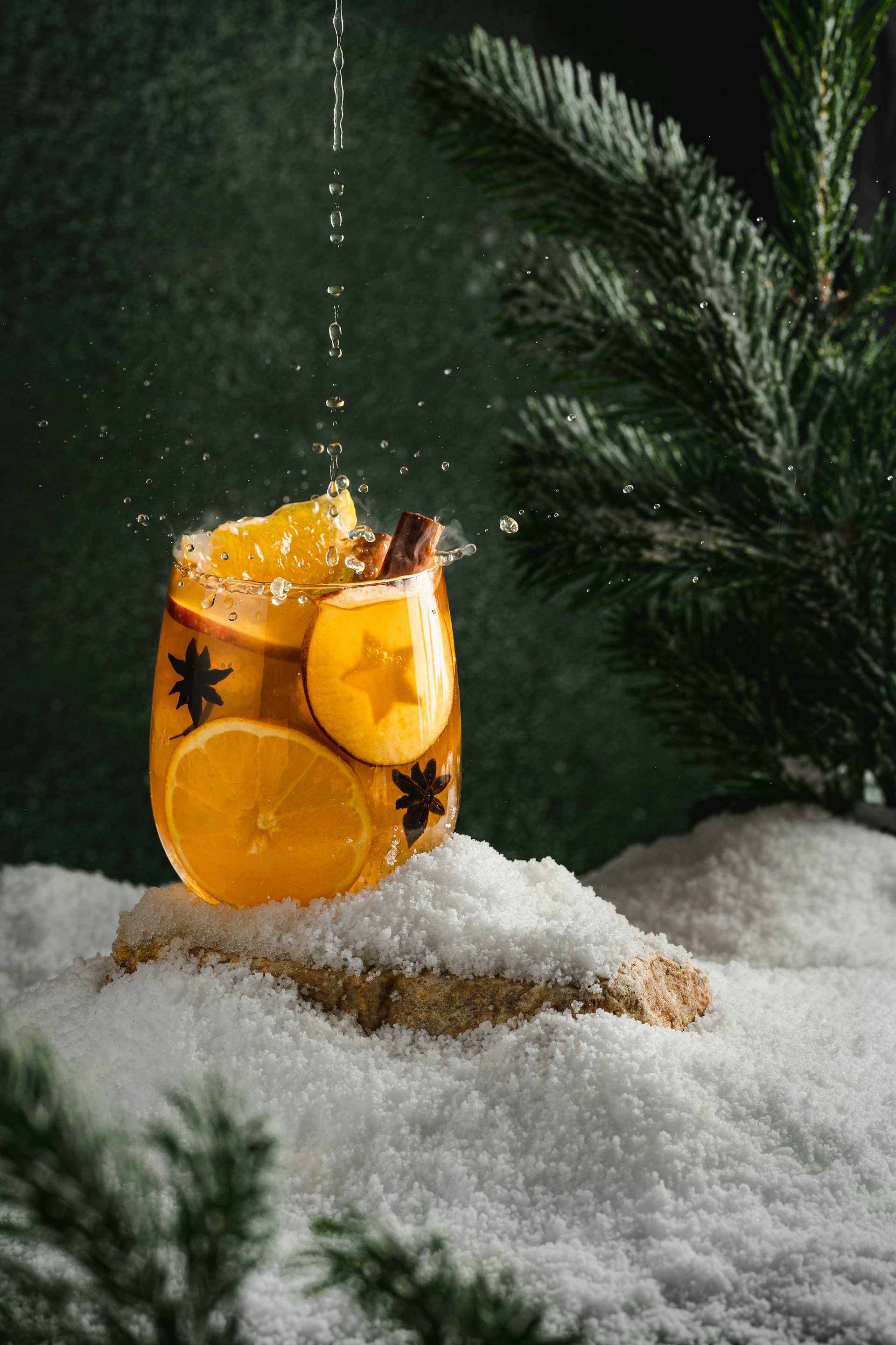 a carved pumpkin in the snow