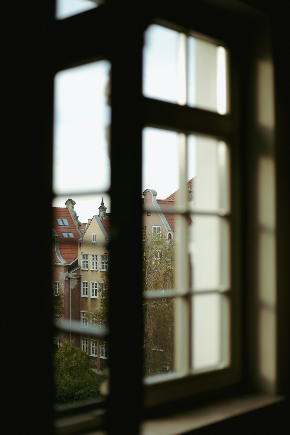a window with a view of buildings
